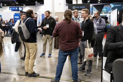 Attendees on the exhibit hall floor at Geo Week 2025.